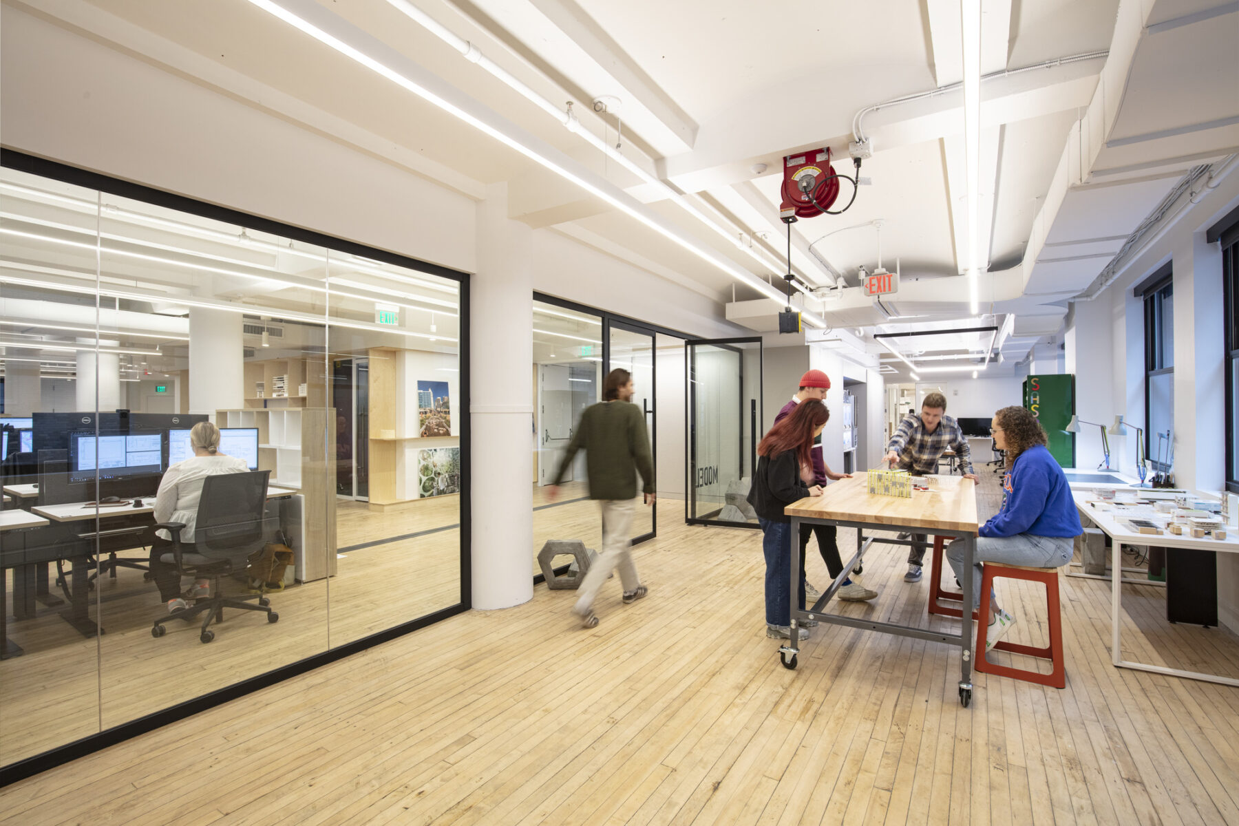 fabrication laboratory with people working around a table