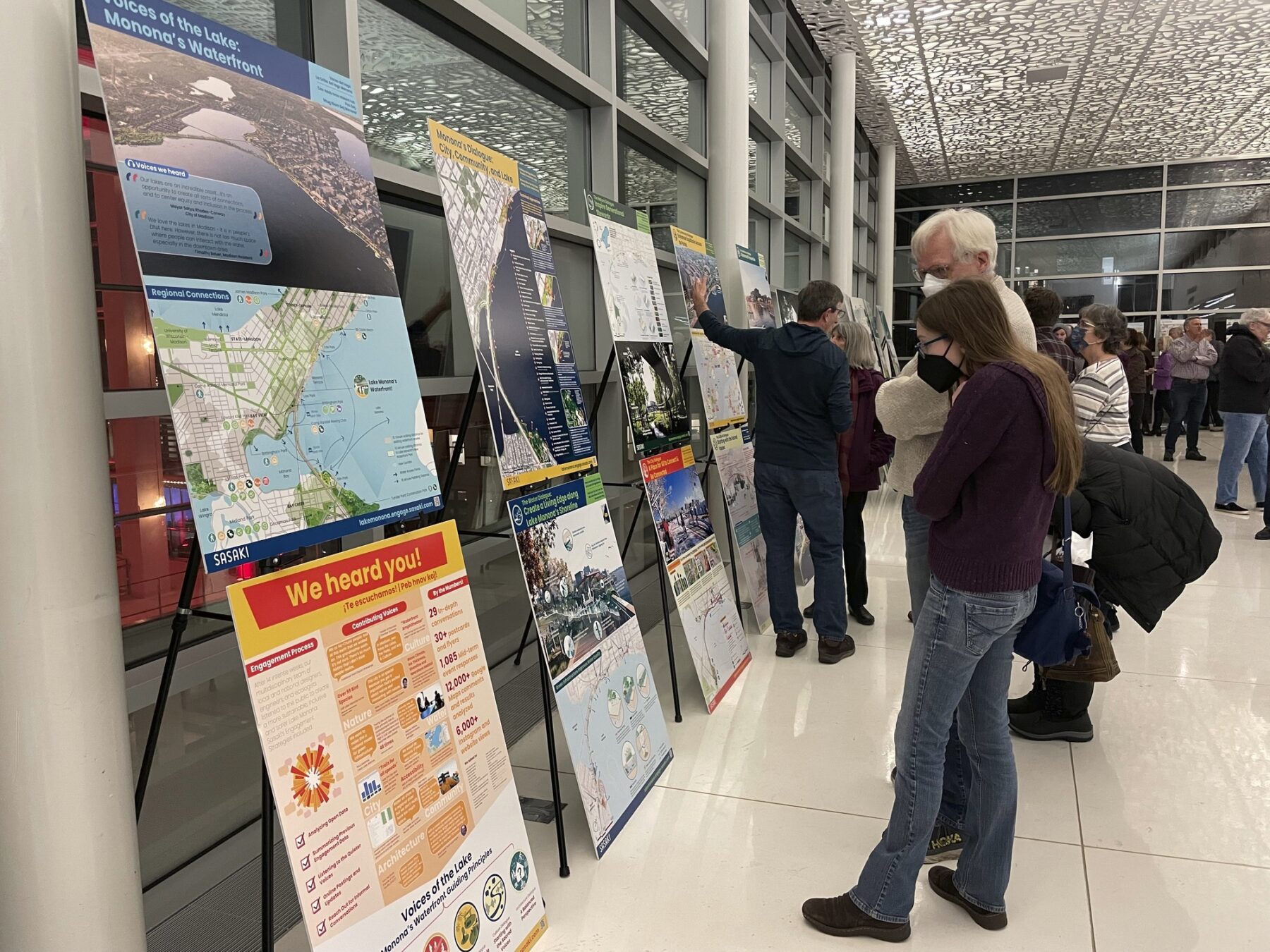 photograph of Madison Community Members review the Sasaki teams’ final Voice’s of the Lake competition submission during an open house event