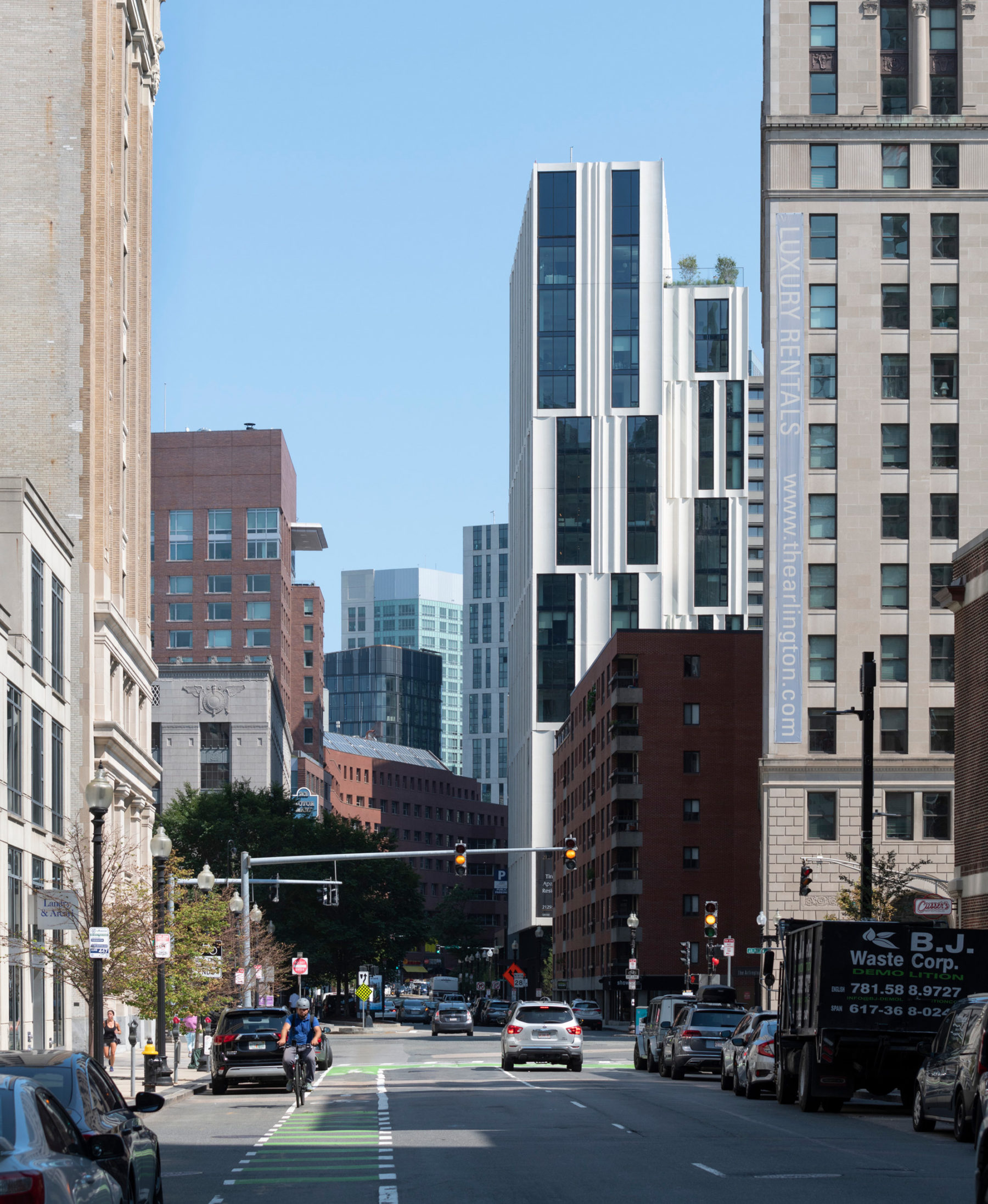 exterior photo of building from down the street. the building is shown in context to other surrounding buildings.